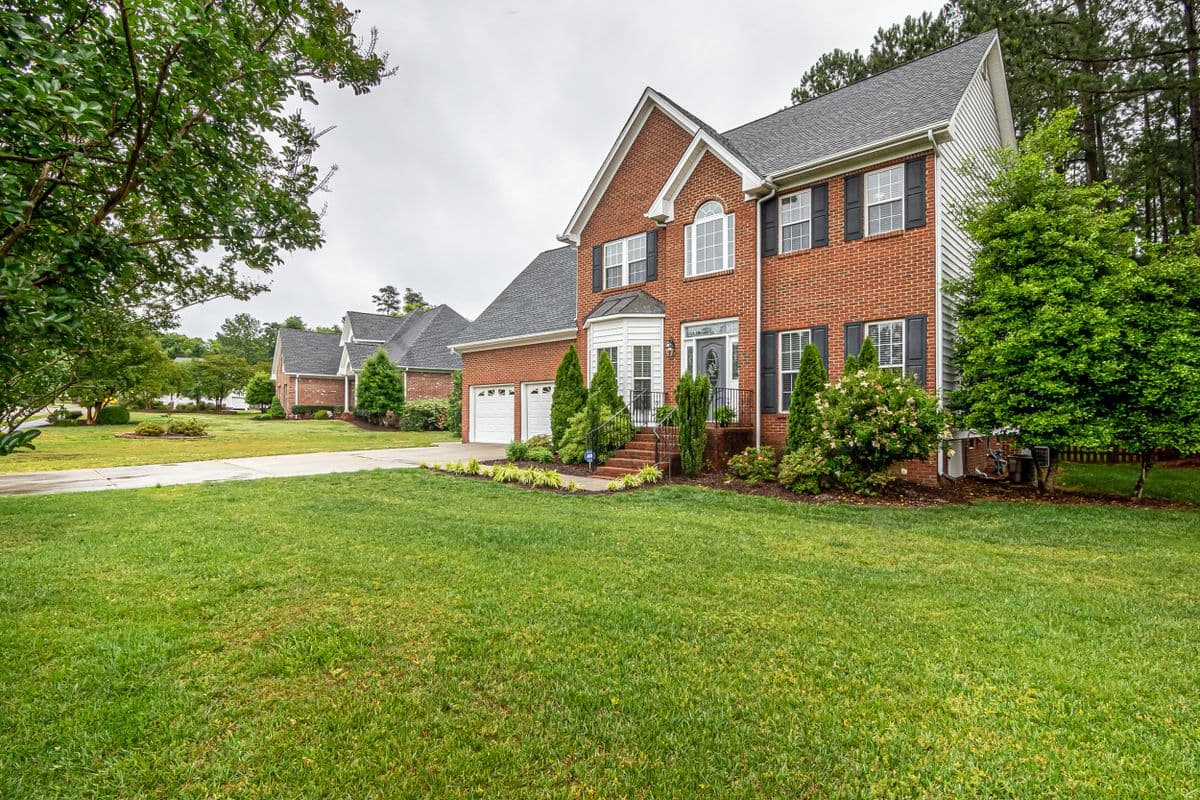 Brick home with a large front lawn